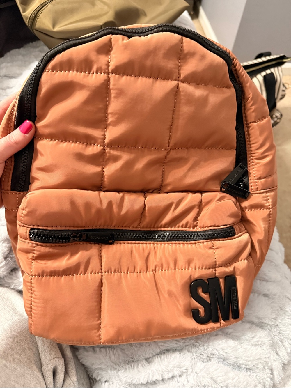 Smaller STEVE MADDEN quilted backpack in warm terracotta